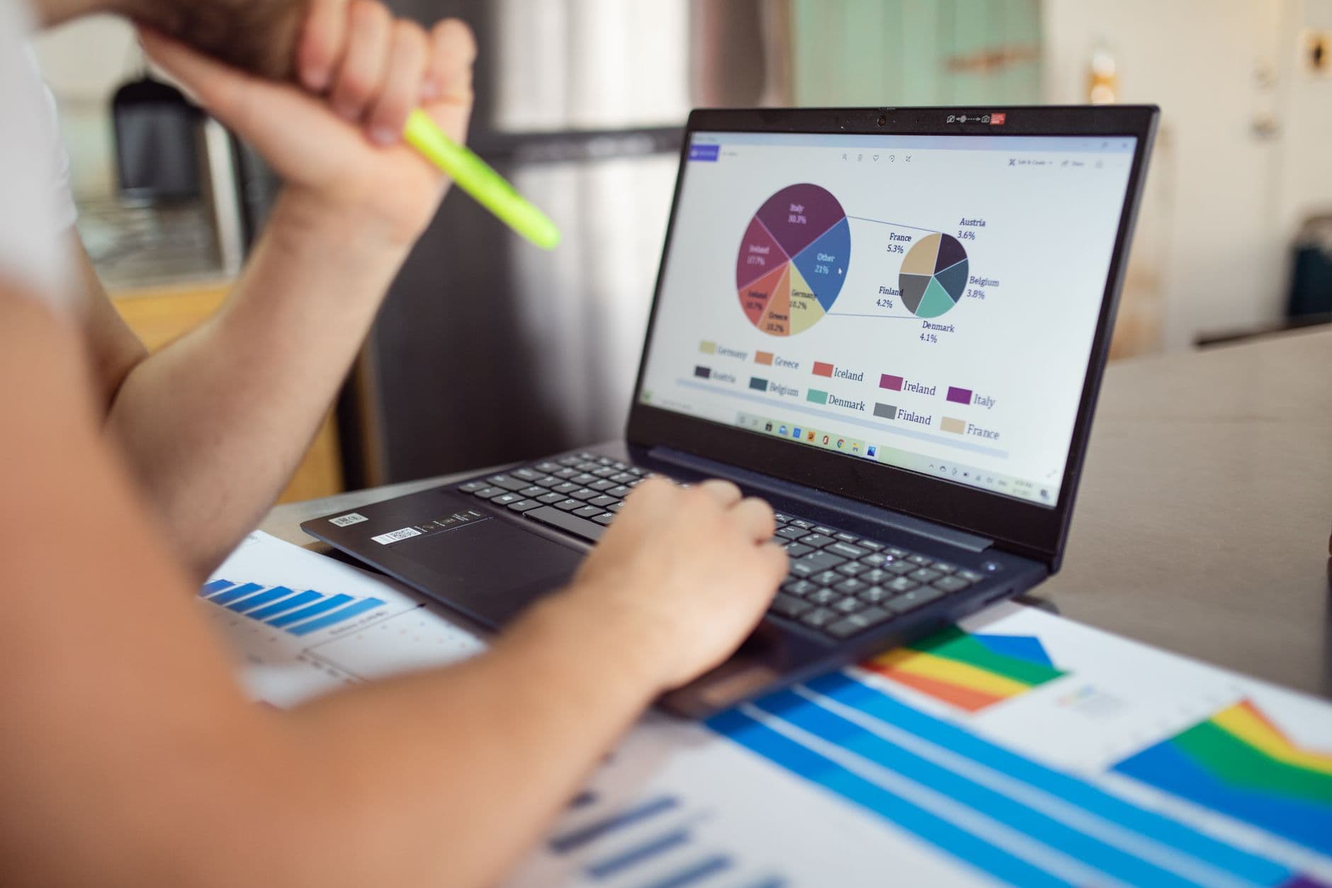 Financial chart and report analysis on laptop